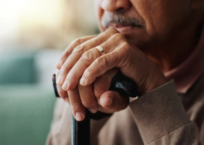Widower sad with his cane and thoughts