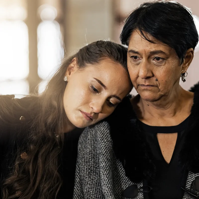 Sad, empathy and funeral with women in church for mourning, grief and death. Loss, respect and cons.
