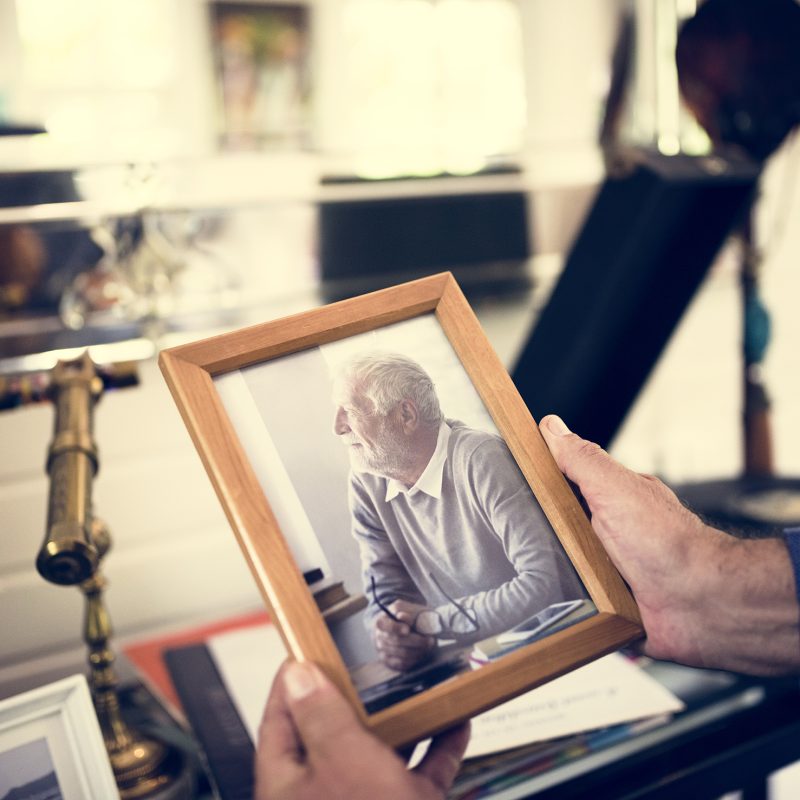 Closeup of hands holding photo frame