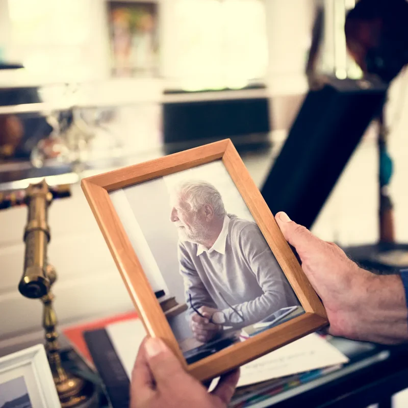Closeup of hands holding photo frame